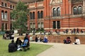 People spending their sunday afternoon in the courtyard at the Victoria and Albert Museum in London