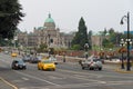 Morning traffic on Government street and British Columbia Legislature in