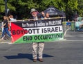 VICTORIA, CANADA- AUGUST 4, 2019: Man stands in downtown victoria protesting-holding a sign for Peace and Justice for Palestine