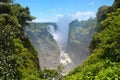 Victoria Falls with rainbow on Zambezi river, falling water from rock, view from Zambia, Africa Royalty Free Stock Photo