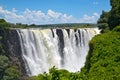 Victoria Falls with rainbow on Zambezi river, falling water from rock, view from Zambia, Africa Royalty Free Stock Photo