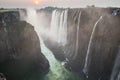 Victoria Falls sunset, Zambia side with zambezi river, red sun