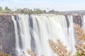 Victoria Falls, a waterfall in southern Africa at the Zambezi River at the border between Zambia and Zimbabwe. Milky water Royalty Free Stock Photo