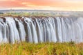 Victoria Falls, a waterfall in southern Africa at the Zambezi River at the border between Zambia and Zimbabwe. Milky water Royalty Free Stock Photo