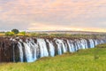 Victoria Falls, a waterfall in southern Africa at the Zambezi River at the border between Zambia and Zimbabwe. Milky water Royalty Free Stock Photo