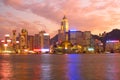 Skyline of skyscrapers in Wan Chai at dusk, with the Hong Kong Convention & Exhibition Centre in the middle Royalty Free Stock Photo