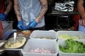 Fast food preparation of hamburgers in an outdoor market in London England Royalty Free Stock Photo