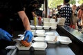 Fast food preparation of hamburger in an outdoor market in London England Royalty Free Stock Photo