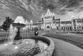 Victoria Parliament building surrounded by garden at night, Brit Royalty Free Stock Photo