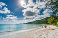 VICTORIA, SEYCHELLES - MAY 10, 2013: Publick beach in Seychelles with few tourists. Sunny day. Royalty Free Stock Photo