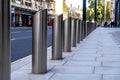 A Row Of Metal Steel Anti Terrorist Bollards Outside The Government Department for Business Energy Industrial Strategy Building
