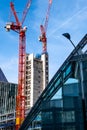 Two Red Tower Cranes Working On A New Build High Rise Tower Block Construction Site Royalty Free Stock Photo