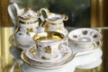 Victorian antique porcelain coffee set in gold and white Royalty Free Stock Photo