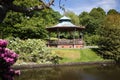 Victorian bandstand with flowers in springtime at Sefton park in Liverpool