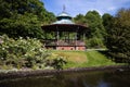 Victorian bandstand with flowers in springtime at Sefton park in Liverpool