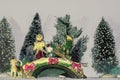 Victorian Christmas people with hoop and dogs on bridge with snowy trees behind_illustration