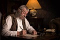 Victorian clerk working at desk Royalty Free Stock Photo