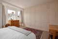Victorian cottage bedroom with fitted wardrobes
