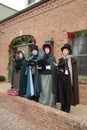 Victorian era re-enactors at a Christmas holiday singing Christmas carols in St. Charles, Missouri.