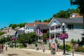 Victorian house lining the streets of Mackinac Island near downtown as tourists walk by in the summer Royalty Free Stock Photo