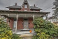 Victorian house porch with Halloween carved pumpkin Royalty Free Stock Photo