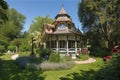 victorian house, with view of garden and gazebo, during warm summer day Royalty Free Stock Photo