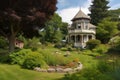 victorian house, with view of garden and gazebo, during warm summer day Royalty Free Stock Photo