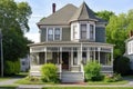 victorian house with wrap-around porch and freshly painted exterior