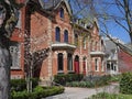 Victorian houses with pointy gables and front gardens