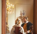 Victorian, man and woman talking in royal castle together with vintage love, romance and banquet hall. Medieval king