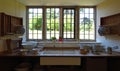 Victorian Sink and utensils and leaded window.