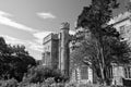 Victorian style architecture and design. Lews Castle in garden of Stornoway, United Kingdom. Castle with green trees on Royalty Free Stock Photo