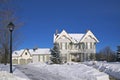 Victorian-style house exterior with street lamp in winter Royalty Free Stock Photo