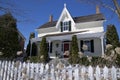 Victorian style house with the white picket fence in winter Royalty Free Stock Photo