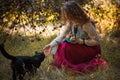 Victorian style, woman at autumn garden with a cat Royalty Free Stock Photo