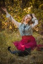 Victorian style, woman at autumn garden with a cat Royalty Free Stock Photo