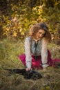 Victorian style, woman at autumn garden with a cat Royalty Free Stock Photo