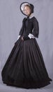 Victorian woman in black bodice. bonnet and skirt