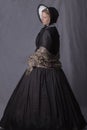 Victorian woman in a black bodice, shawl and bonnet Royalty Free Stock Photo