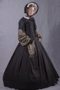 Victorian woman in a black bodice, shawl and bonnet