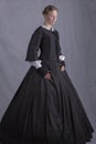 Victorian woman in a black bodice and skirt