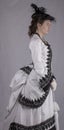 Victorian woman in black and white bustle dress Royalty Free Stock Photo