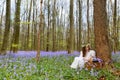 Victorian woman in bluebells forest Royalty Free Stock Photo