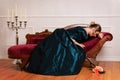 Victorian woman crying on couch Royalty Free Stock Photo