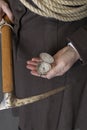 A Victorian woman wearing a mountaineering ensemble and holding rope and a pick