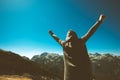 Victorious female person on mountain top. Royalty Free Stock Photo