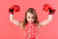 Victory, champion, winner. Kid boxer with long hair on red background. Royalty Free Stock Photo