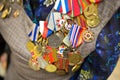 Victory Day. Orders and medals on the chest of a veteran. Close-up. Royalty Free Stock Photo