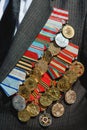 Victory Day. Orders and medals on the chest of a veteran. Close-up. Royalty Free Stock Photo