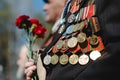 Victory Day. Orders and medals on the chest of a veteran. Close-up. Royalty Free Stock Photo